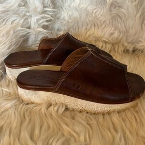 These Bed Stu slide platform sandals in a dark brown, they are a size7.5